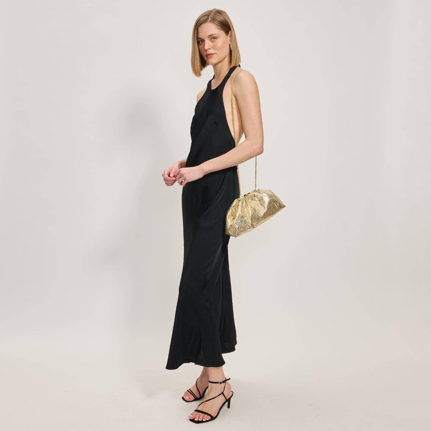 Elegance in Motion Crossbody Handbag: Gold